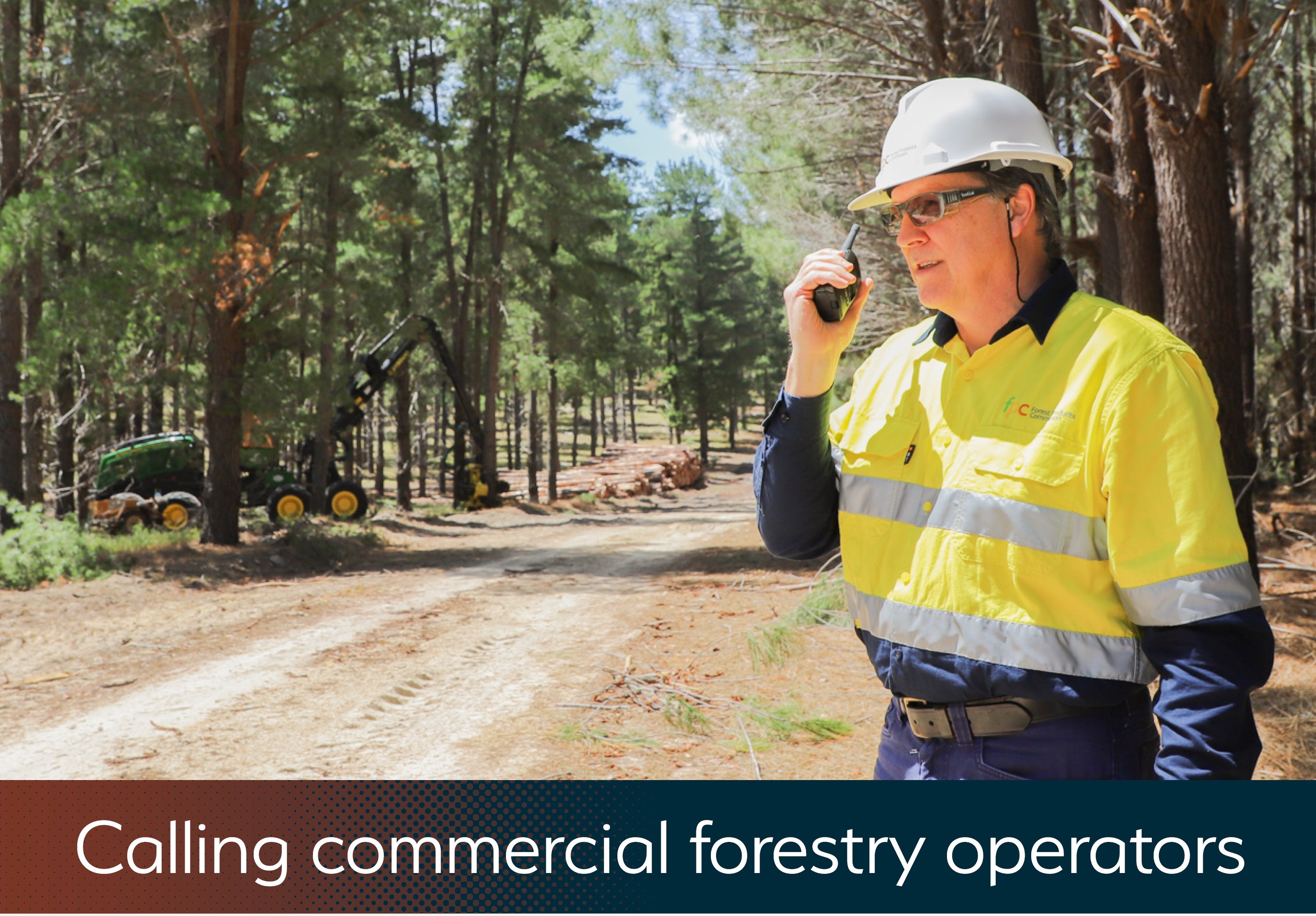 Man talking on a two-way radio in the forest.